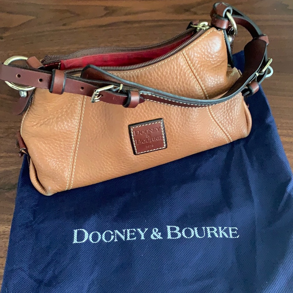 Dooney & Bourke shoulder bag. Used,good condition. Tan leather and brass accent